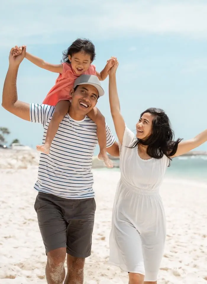 Family enjoying sandy beach day