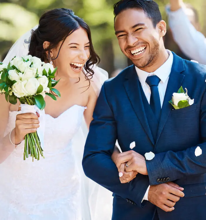 Happy wedding couple smiling together