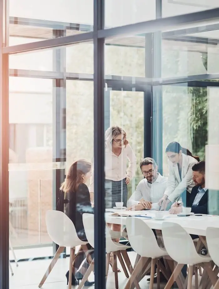 Team meeting in glass office