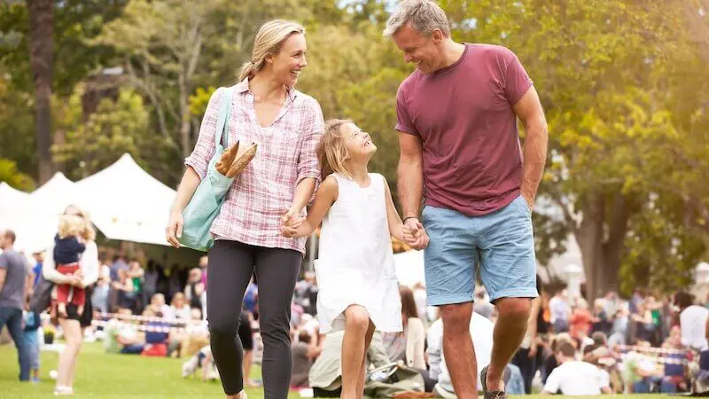 Family enjoying outdoor festival grounds