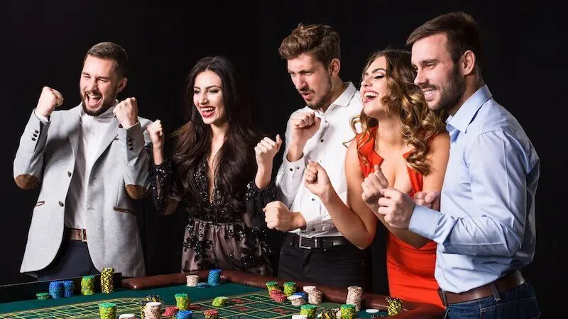 People enjoying casino table game